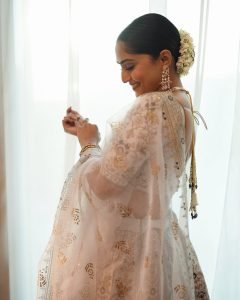 Bridal lehenga styling highlights Reba Monica John's regal presentation