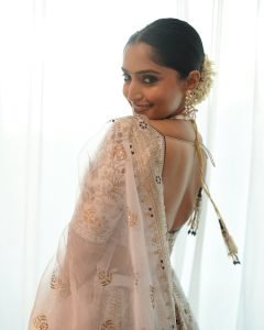 Golden wedding lehenga showcases Reba Monica John's traditional fashion sense