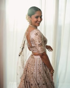 Golden wedding lehenga showcases Reba Monica John's traditional fashion sense
