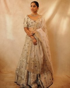 Golden wedding lehenga showcases Reba Monica John's traditional fashion sense