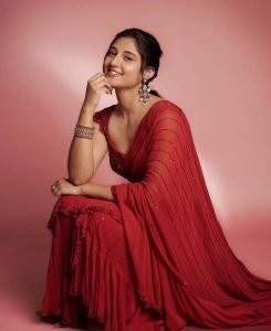 Traditional sheer red saree elegance showcased by Ritika Nayak with pearl jewelry