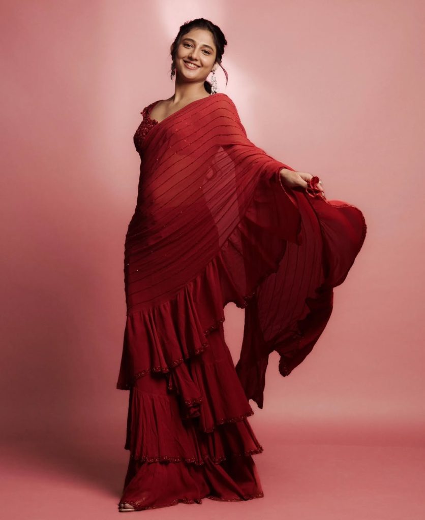 Traditional sheer red saree elegance showcased by Ritika Nayak with pearl jewelry