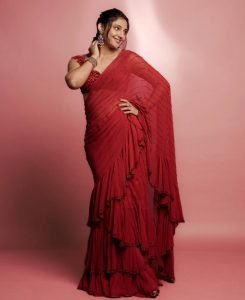 Elegant pearl jewelry complements Ritika Nayak's sheer red traditional styling