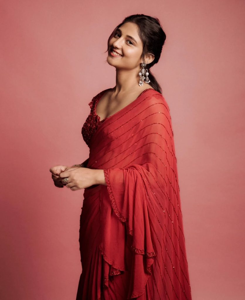 Ritika Nayak embodies classic grace in sheer red saree and pearl accessories