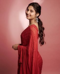Ritika Nayak embodies classic grace in sheer red saree and pearl accessories