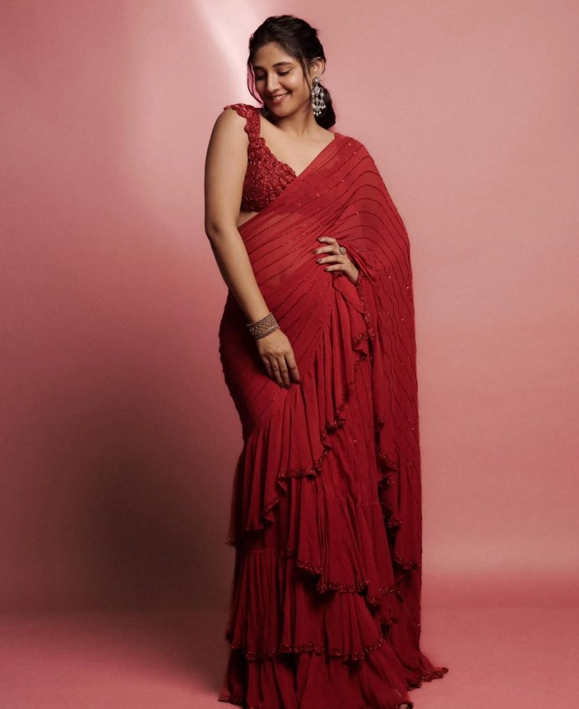 Ritika Nayak embodies classic grace in sheer red saree and pearl accessories