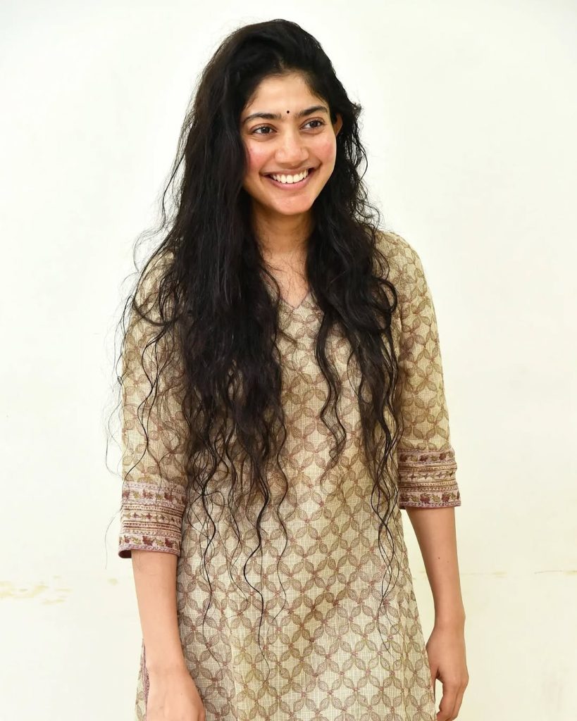 Natural loose hair flows freely creating organic, authentic beauty for Sai Pallavi