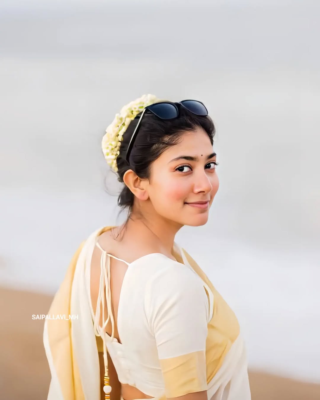 Beach setting creates natural backdrop for Sai Pallavi's white saree styling