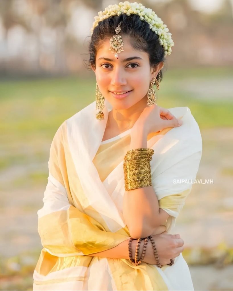 Beach setting creates natural backdrop for Sai Pallavi's white saree styling
