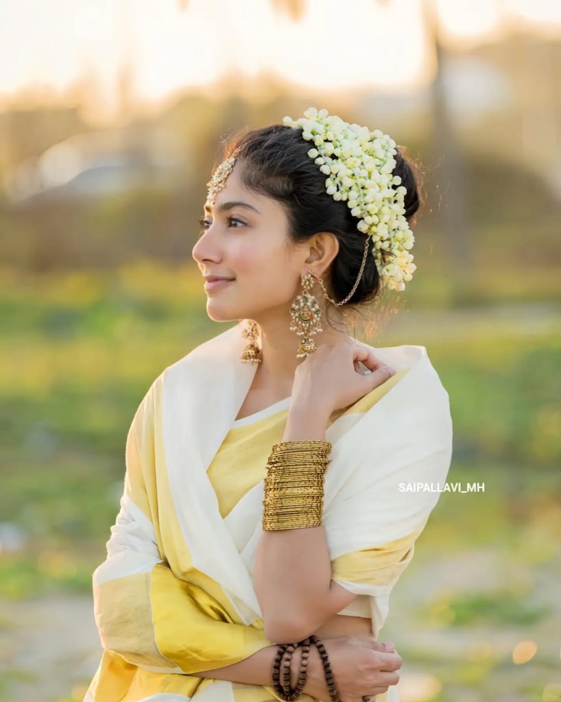 Sai Pallavi embodies grace in white saree with oceanic environment