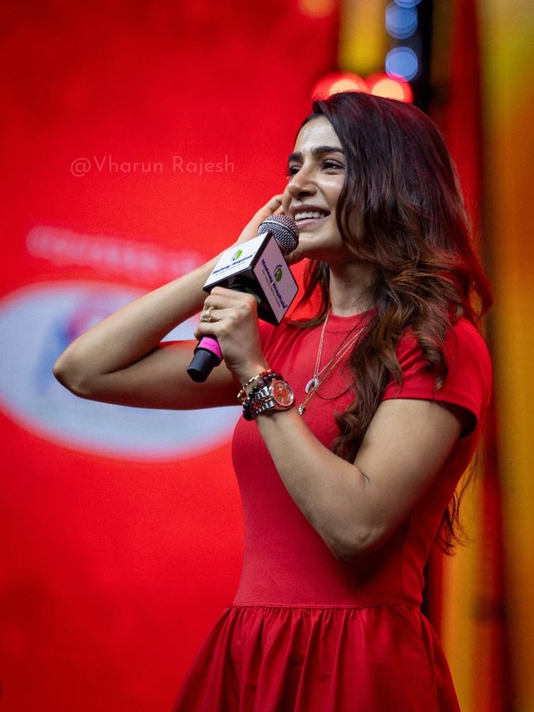 Red dress fabric texture visible in detailed closeup photography of Samantha