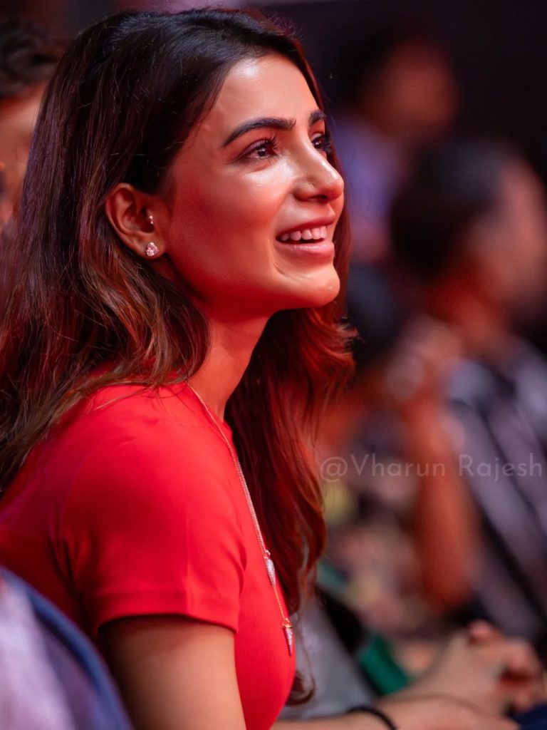 Red dress fabric texture visible in detailed closeup photography of Samantha