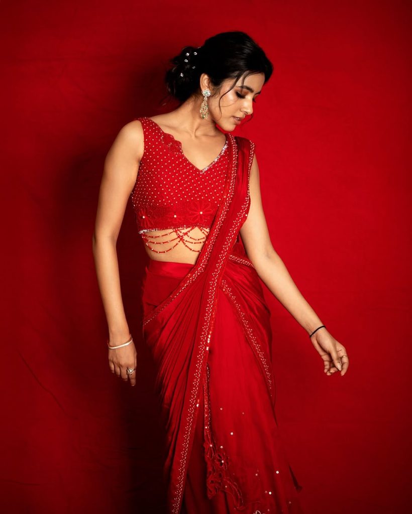 Shivani Nagaram radiates confidence in striking red hot ensemble
