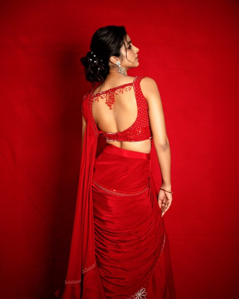 Shivani Nagaram radiates confidence in striking red hot ensemble