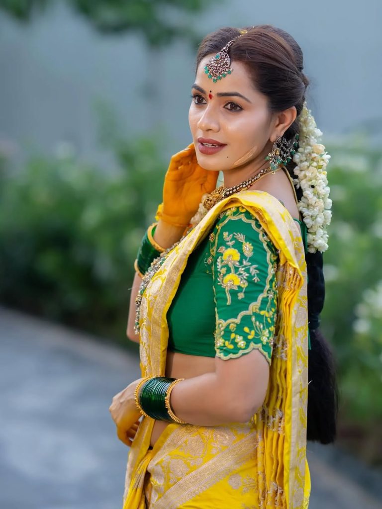 Vibrant yellow saree creates beautiful traditional elegance for Shobha Shetty