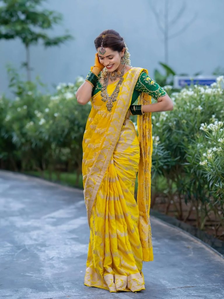 Vibrant yellow saree creates beautiful traditional elegance for Shobha Shetty
