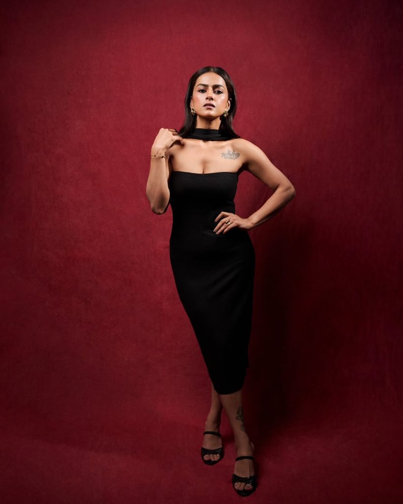 Minimal jewelry approach emphasizes Shraddha's tattoo and dress combination