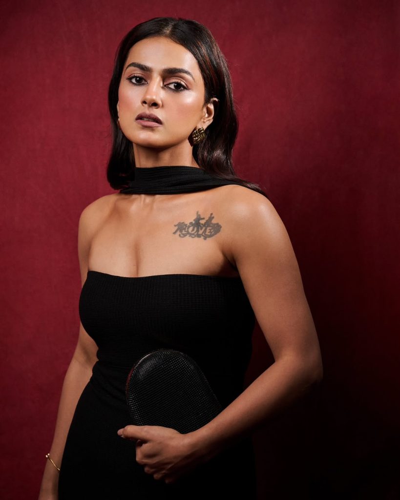 Contemporary tube dress highlights Shraddha's arm tattoo artistic expression