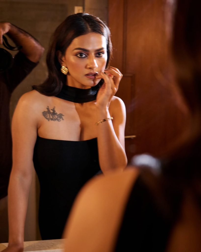 Contemporary tube dress highlights Shraddha's arm tattoo artistic expression