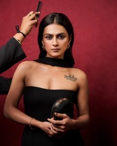 Contemporary tube dress highlights Shraddha's arm tattoo artistic expression