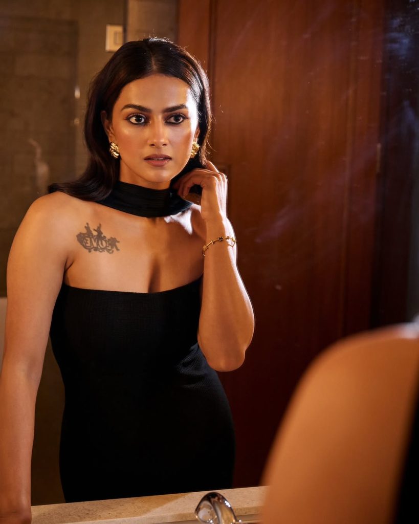 Shraddha embodies confidence in minimalist black tube dress with body art