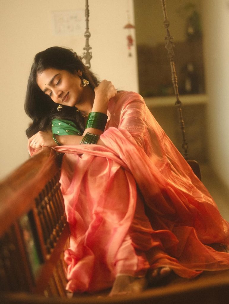 Elegant saree draping showcases Yoga Lakshmi's traditional fashion expertise