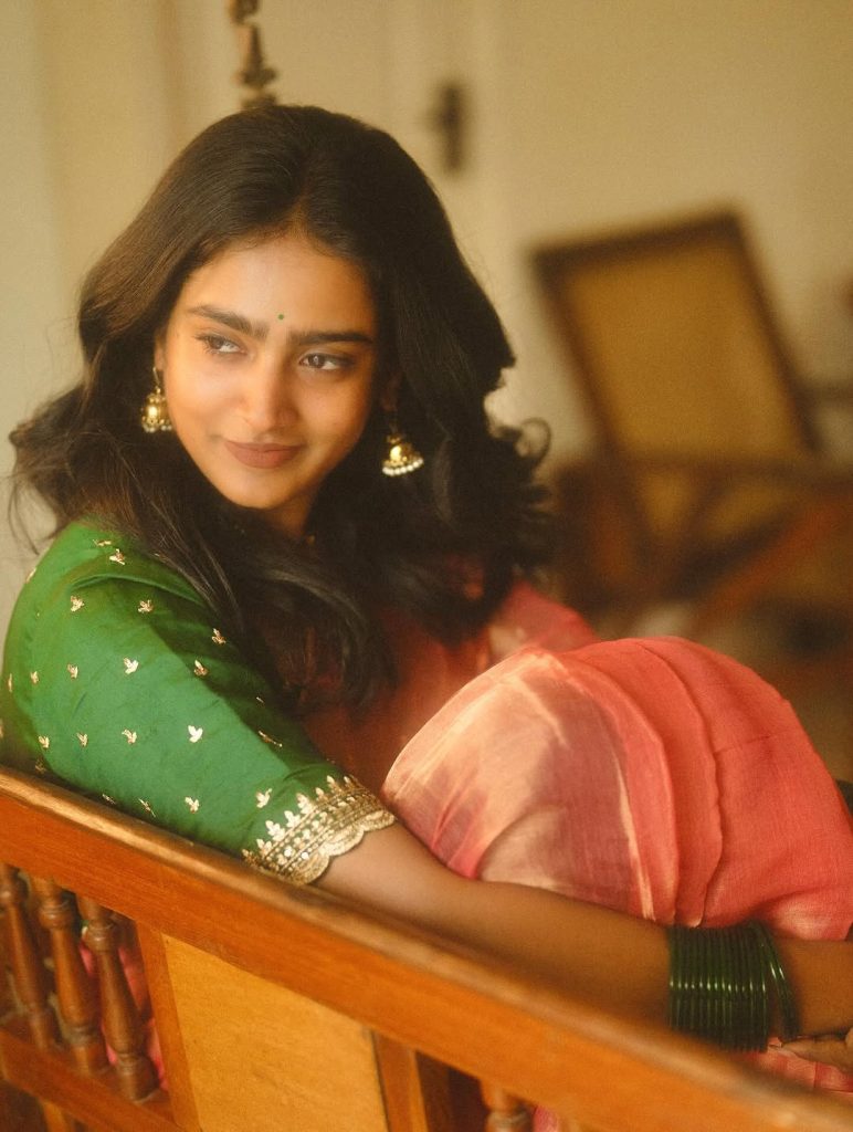 Elegant saree draping showcases Yoga Lakshmi's traditional fashion expertise