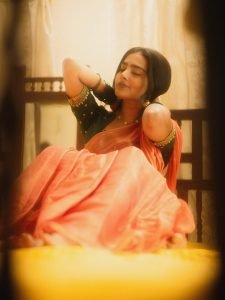 Elegant saree draping showcases Yoga Lakshmi's traditional fashion expertise