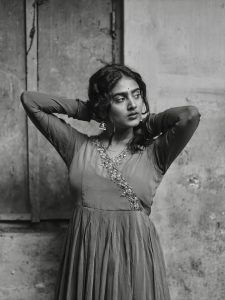 Purple pleated gown creates graceful movement in Yoga Lakshmi's outdoor photography
