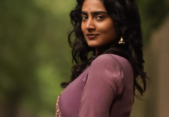 Purple pleated gown creates graceful movement in Yoga Lakshmi's outdoor photography