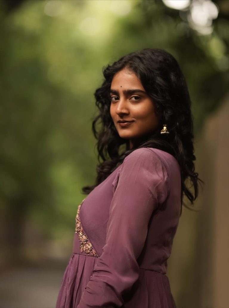 Purple pleated gown creates graceful movement in Yoga Lakshmi's outdoor photography