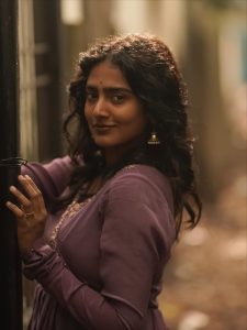 Yoga Lakshmi embodies sophisticated charm in flowing purple pleated ensemble