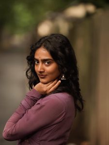 Yoga Lakshmi embodies sophisticated charm in flowing purple pleated ensemble