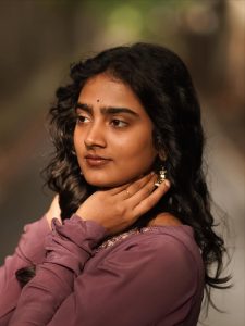 Yoga Lakshmi embodies sophisticated charm in flowing purple pleated ensemble