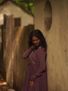 Yoga Lakshmi embodies sophisticated charm in flowing purple pleated ensemble