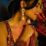 Close-up of Aarushi Baruah bandhani tie-dye pattern saree seaside