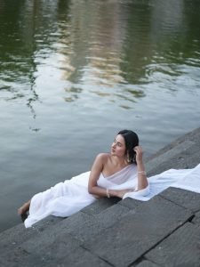 Lakeside reflections with Aarushi Baruah elegant white saree pose