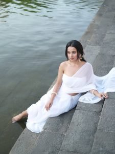 Aarushi Baruah peaceful expression in flowing white chiffon saree