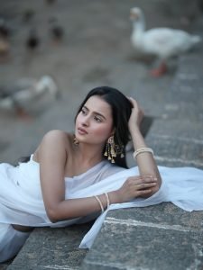 Lakeside reflections with Aarushi Baruah elegant white saree pose