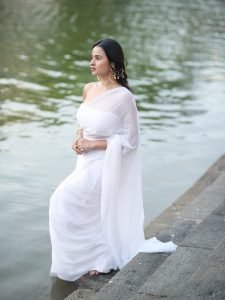 Aarushi Baruah peaceful expression in flowing white chiffon saree