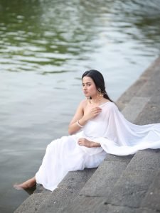 Aarushi Baruah peaceful expression in flowing white chiffon saree