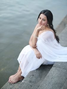 Aarushi Baruah peaceful expression in flowing white chiffon saree