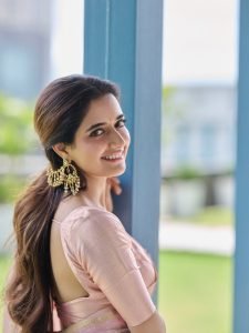 Ashika Ranganath elegant pink silk saree traditional studio portrait