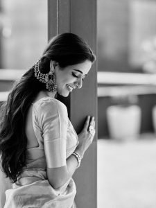 Ashika Ranganath graceful pose in traditional pink silk draping