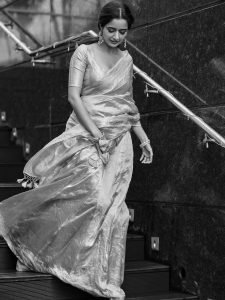 Ashika Ranganath graceful pose in traditional pink silk draping