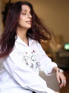 Bhumika Chawla carefree pose in white printed casual shirt