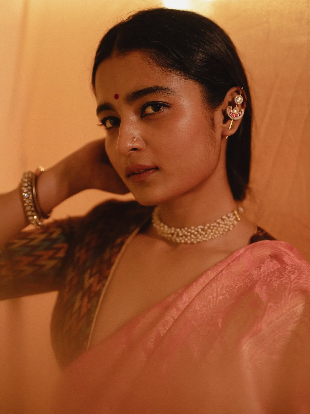 Chaithra J Achar rose saree with traditional ikat pattern blouse