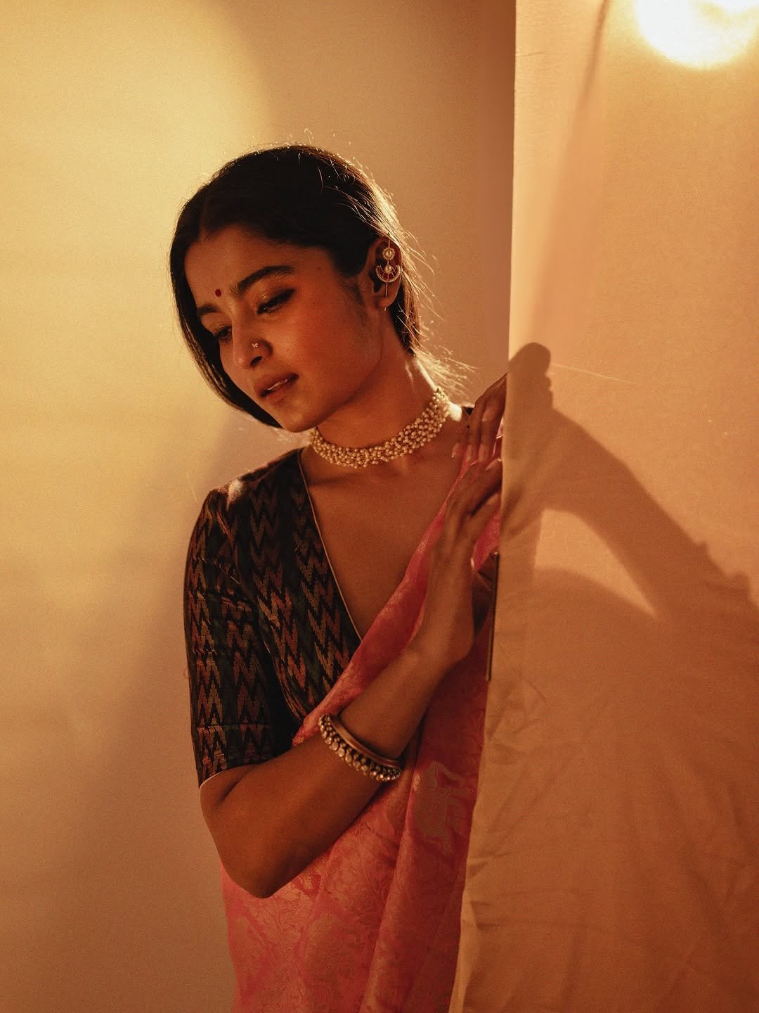 Chaithra J Achar rose saree ikat blouse pearl choker warm glow Portrait (3)