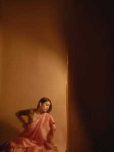 Pearl choker necklace detail on Chaithra J Achar elegant portrait