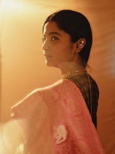 Pearl choker necklace detail on Chaithra J Achar elegant portrait